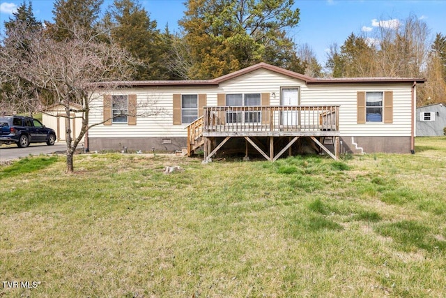 manufactured / mobile home with stairs, crawl space, a wooden deck, and a front yard