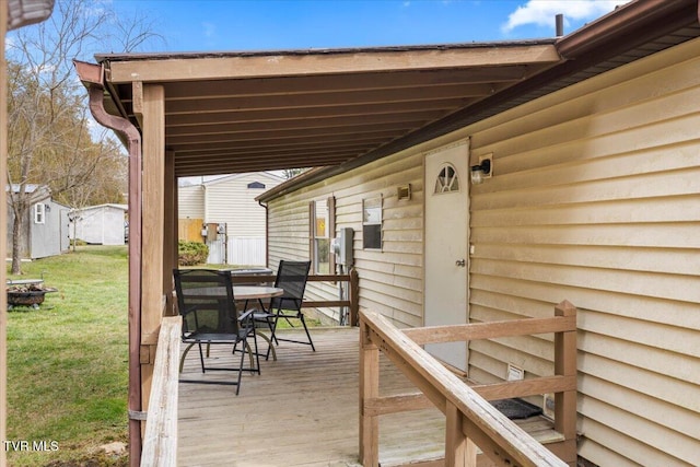 deck featuring a lawn