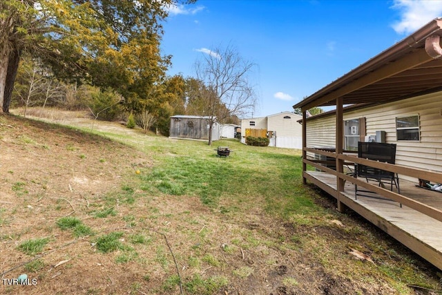 view of yard with a wooden deck