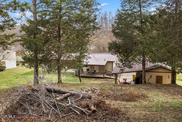 view of yard with a wooden deck