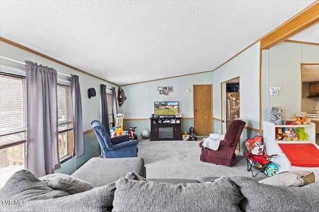 living room featuring carpet flooring, a textured ceiling, crown molding, and vaulted ceiling