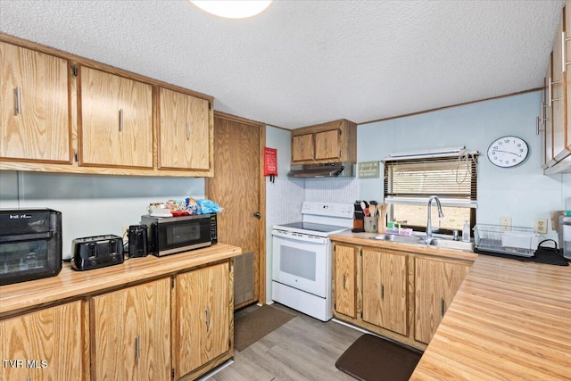 kitchen featuring under cabinet range hood, light wood-style flooring, white range with electric stovetop, a textured ceiling, and a sink