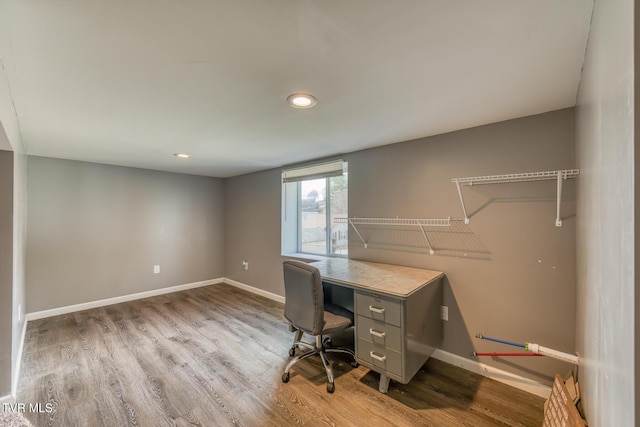 office space featuring recessed lighting, baseboards, and wood finished floors