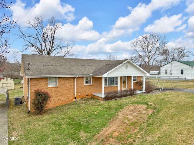 view of front of home with brick siding, central AC unit, a shingled roof, and a front yard