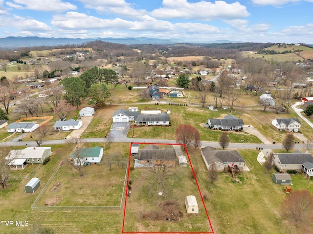 birds eye view of property featuring a mountain view