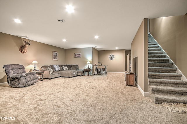 living area featuring visible vents, baseboards, stairs, carpet flooring, and recessed lighting