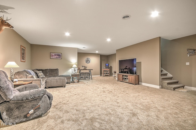 carpeted living area featuring stairs, recessed lighting, baseboards, and visible vents