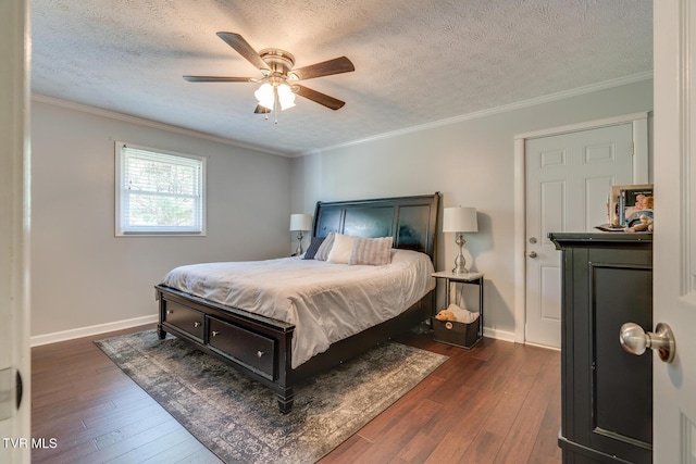 bedroom featuring baseboards, dark wood-type flooring, and crown molding