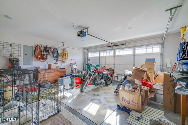 garage with electric panel and a garage door opener