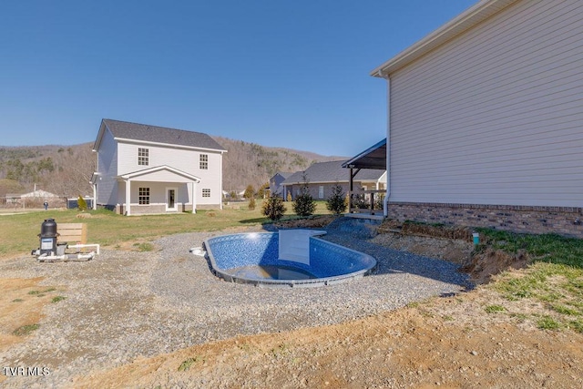 view of pool with a mountain view