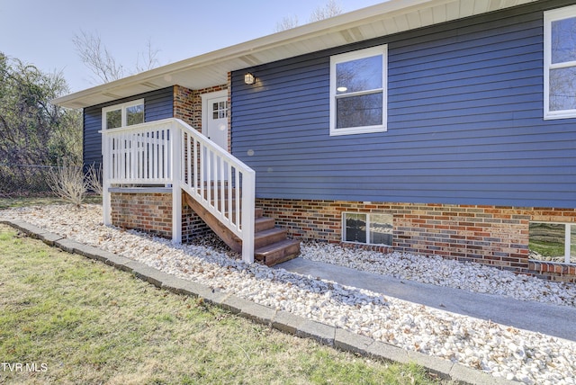 view of exterior entry with fence