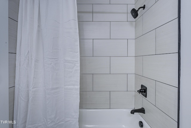 bathroom with shower / bath combination with curtain