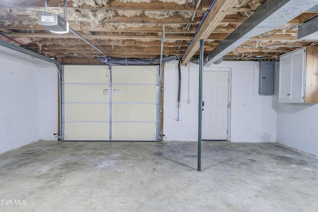 garage featuring electric panel and a garage door opener