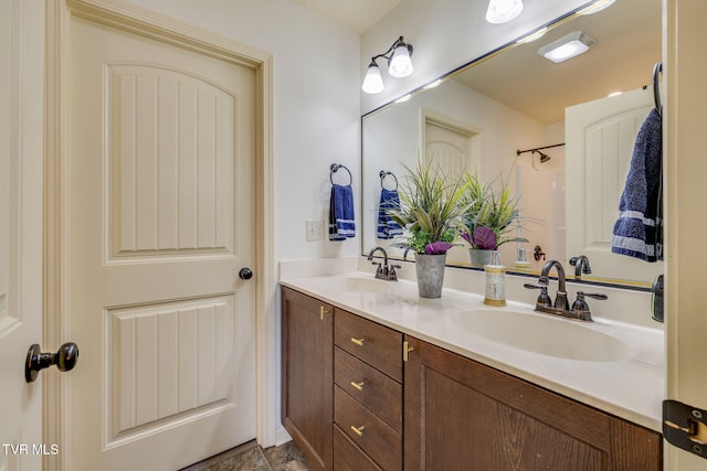 full bath with double vanity and a sink