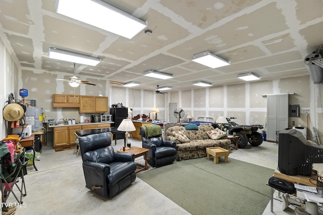 living room featuring concrete floors and ceiling fan