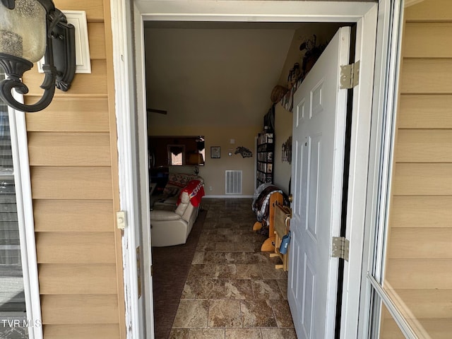 interior space with baseboards and visible vents