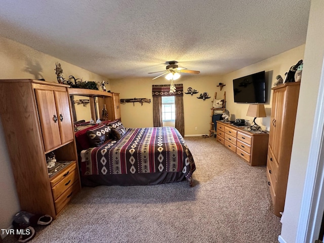 bedroom featuring baseboards, light colored carpet, a ceiling fan, and a textured ceiling