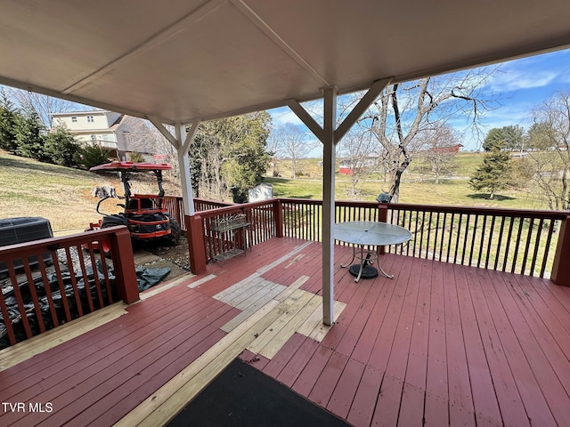 deck featuring a yard and central AC unit