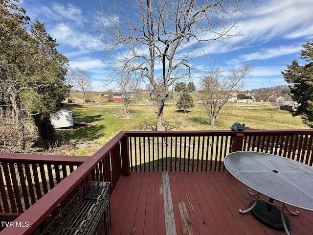 wooden terrace with a yard