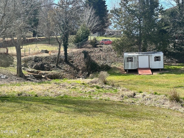 view of yard featuring an outbuilding and a shed