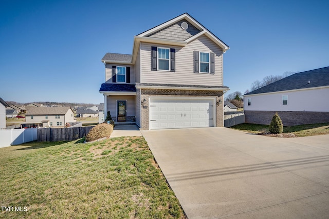 view of front of home featuring a front lawn, brick siding, driveway, and fence