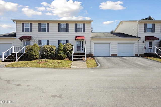 view of front facade featuring aphalt driveway and a garage