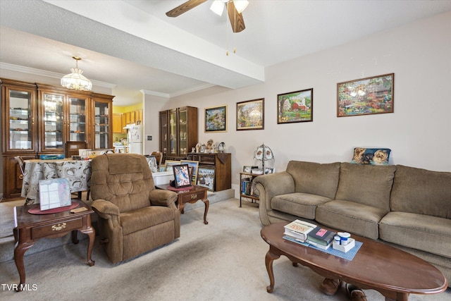 living area with light colored carpet, ceiling fan with notable chandelier, and ornamental molding