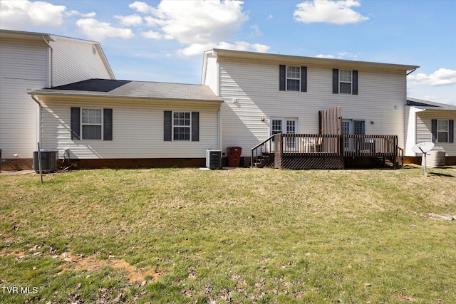 back of property featuring a lawn, cooling unit, and a wooden deck