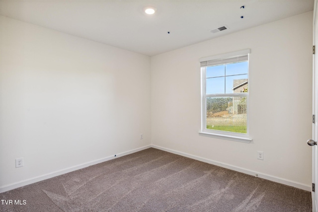 carpeted empty room featuring recessed lighting, baseboards, and visible vents