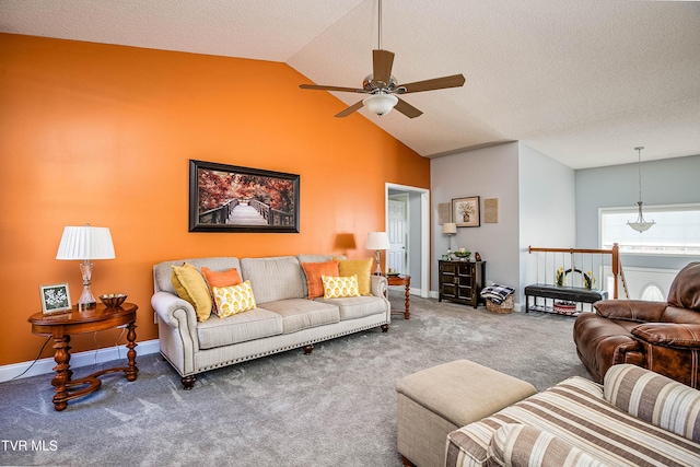 carpeted living room featuring a textured ceiling, high vaulted ceiling, baseboards, and ceiling fan