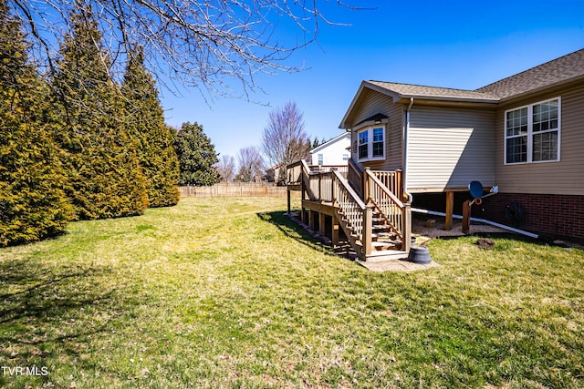 view of yard featuring stairway, a deck, and fence