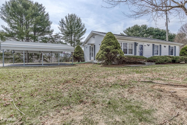 exterior space featuring a carport and a front yard