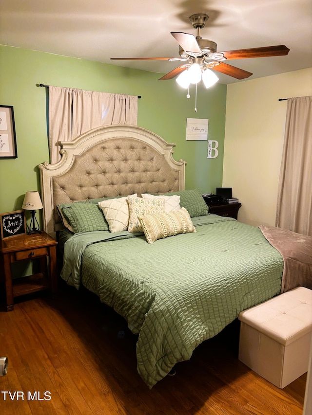 bedroom with ceiling fan and wood finished floors