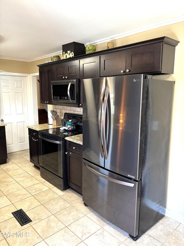 kitchen with ornamental molding, light stone counters, backsplash, dark brown cabinetry, and appliances with stainless steel finishes