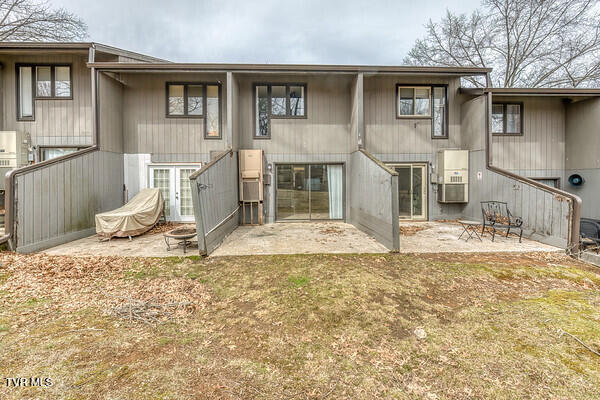 rear view of property featuring a patio area and french doors