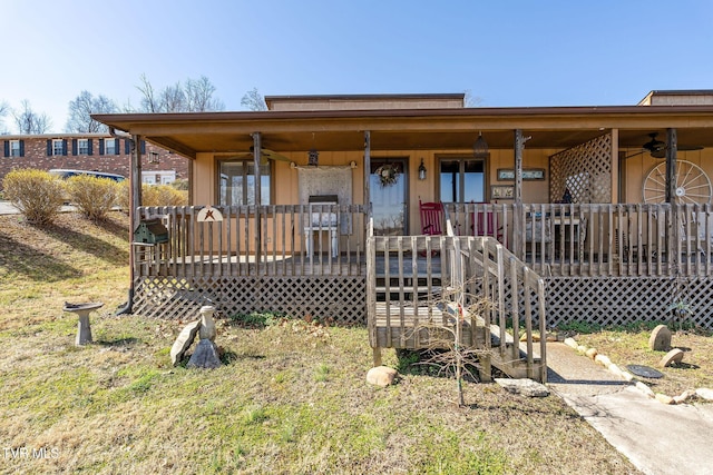 view of front of home with covered porch and a ceiling fan