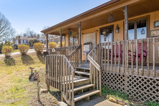 wooden terrace featuring covered porch