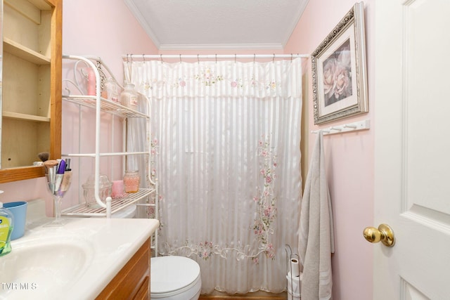 full bath featuring toilet, curtained shower, a textured ceiling, crown molding, and vanity