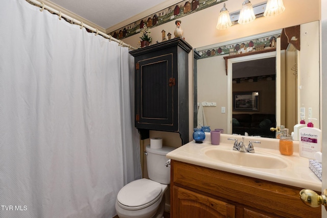 bathroom with a shower with shower curtain, toilet, and vanity