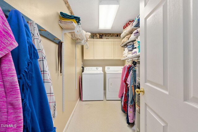 laundry area featuring cabinet space and independent washer and dryer