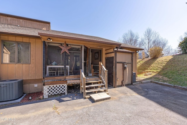 exterior space featuring crawl space, roof with shingles, central AC, and french doors