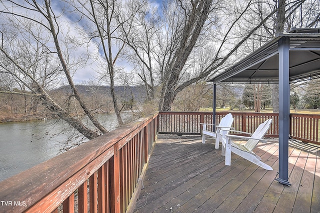 wooden deck with a water view