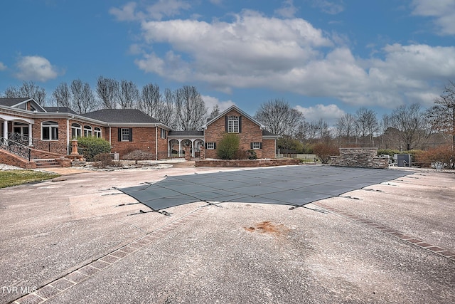 view of swimming pool featuring a fenced in pool, a patio, and fence