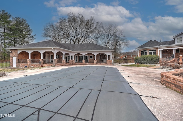 view of swimming pool featuring a fenced in pool and covered porch