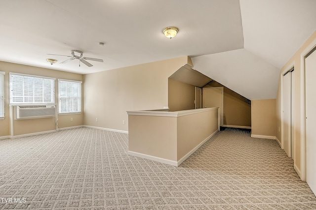 bonus room with cooling unit, baseboards, light colored carpet, ceiling fan, and vaulted ceiling