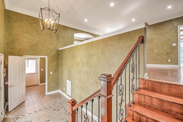 stairs featuring tile patterned flooring, visible vents, crown molding, recessed lighting, and an inviting chandelier