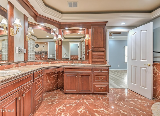 bathroom with double vanity, visible vents, and a sink