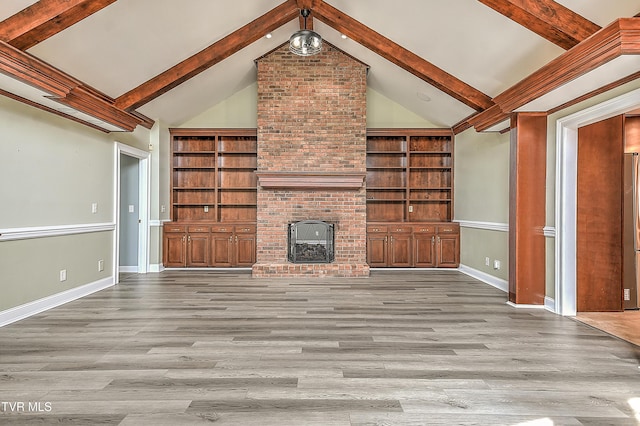 unfurnished living room featuring beamed ceiling, high vaulted ceiling, baseboards, and wood finished floors