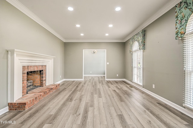 unfurnished living room featuring baseboards, a fireplace, recessed lighting, ornamental molding, and light wood-style floors