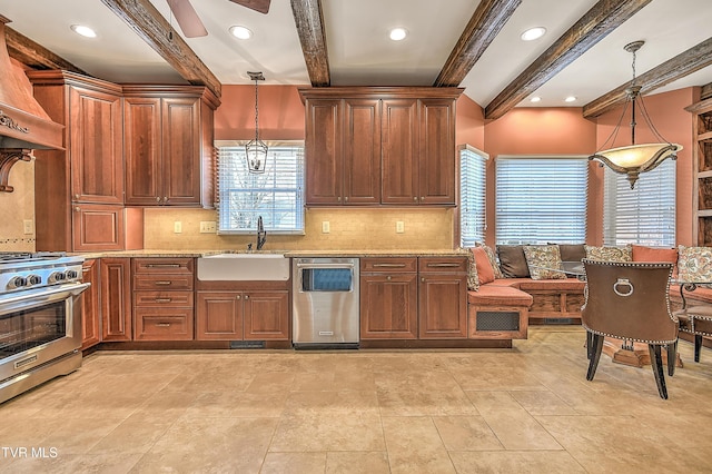 kitchen featuring ceiling fan, decorative light fixtures, custom exhaust hood, stainless steel appliances, and a sink